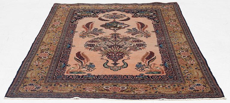 A semi-antique pictoral Kashan rug, part silk, c 207 x 134 cm.