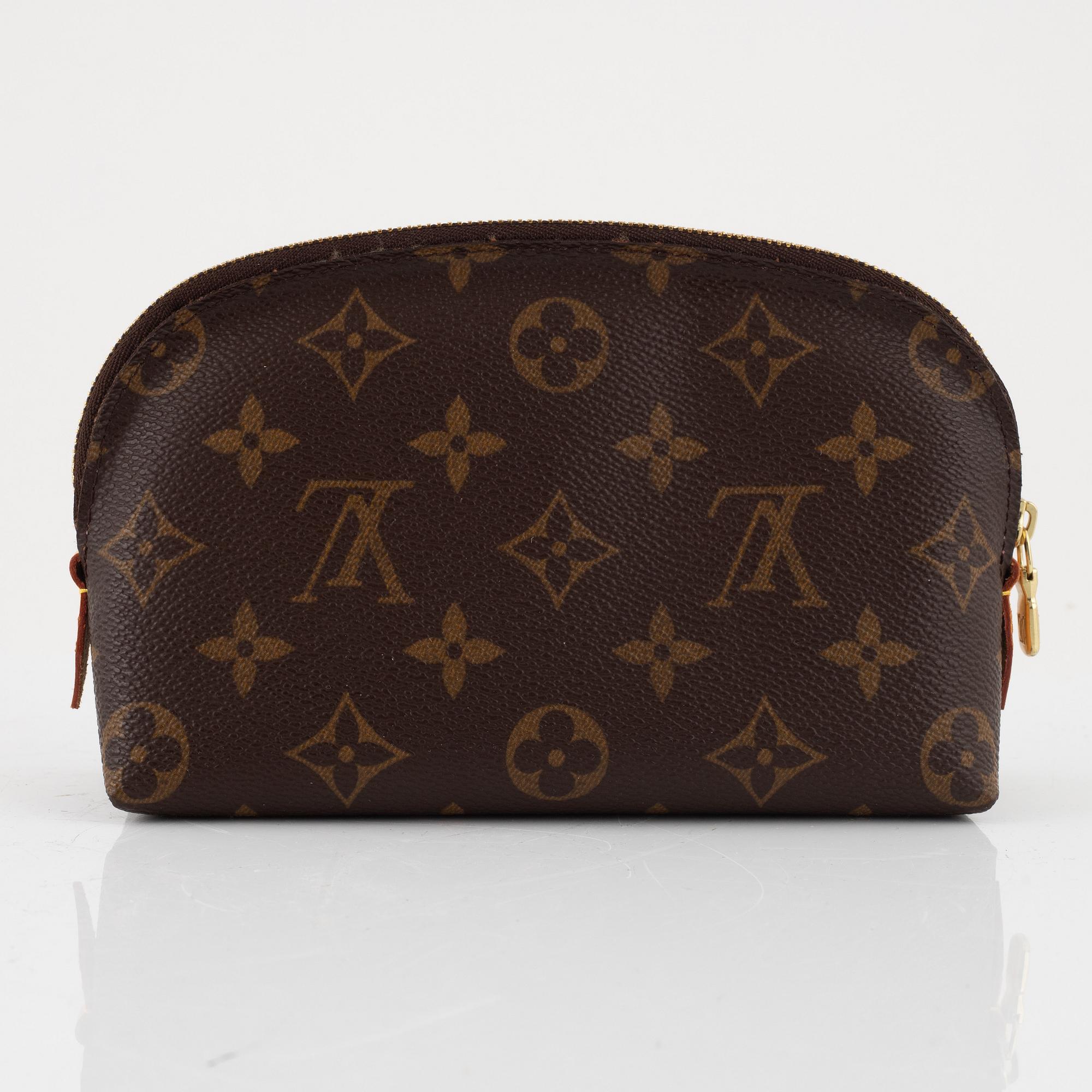 Louis Vuitton, makeup bag and wallet.