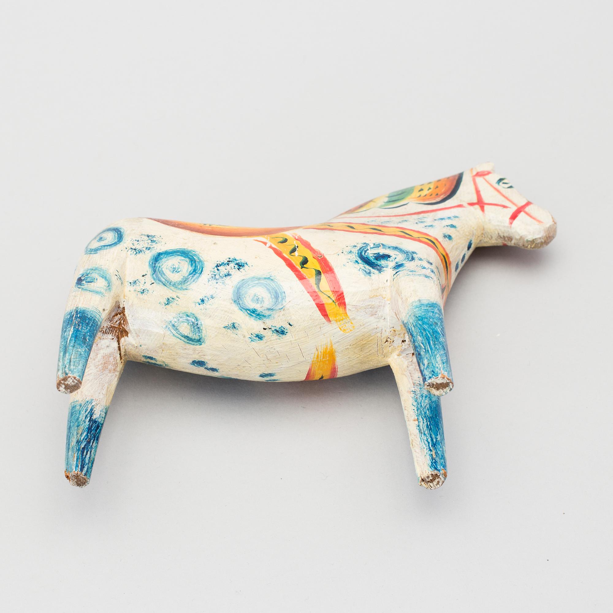 A painted folk art dala horse first half of the 20th century.