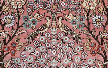 An oriental silk rug, approx. 155 x 93 cm.