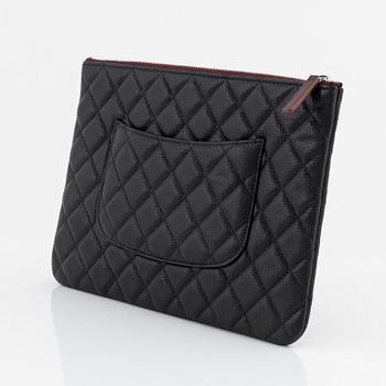 Chanel, a black caviar leather clutch, 2020.
