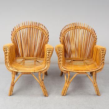 A pair of rattan armchairs, Emilio Paoli, via Vigna Nuova, 8, Firenze, Italy, second half of the 20th century. Signed.