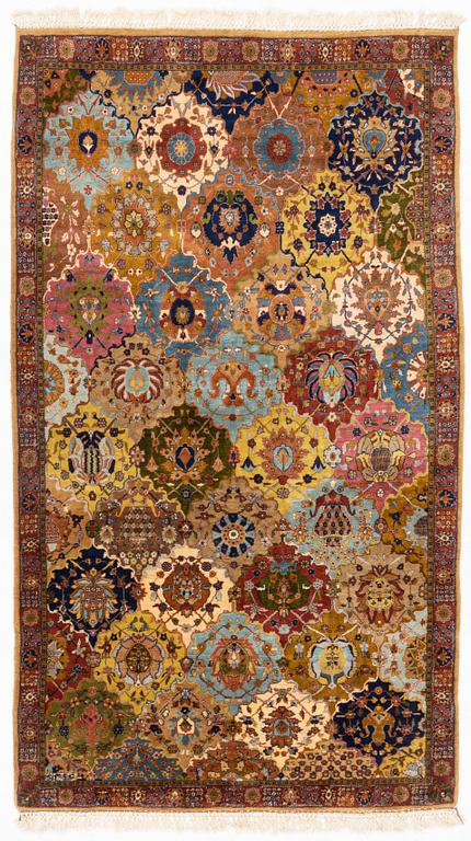 A semi-antique Safavid 'vase' design rug from Lahore, c. 243 x 141 cm.