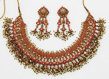 An Indian demi parure comprising a necklace and a pair of earrings.
