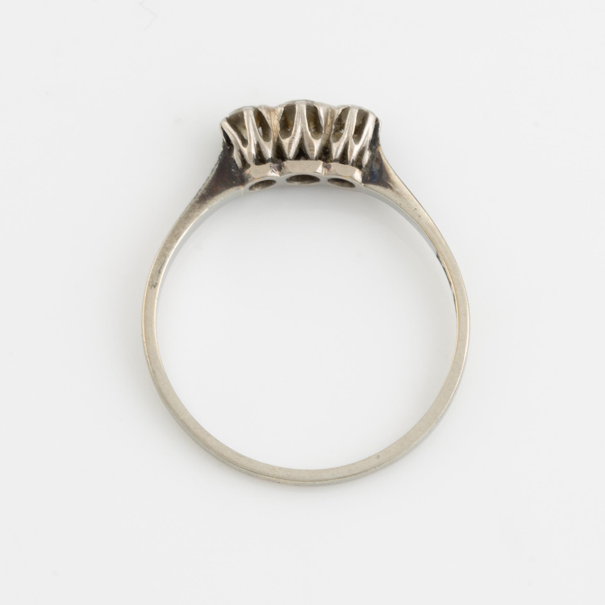 White gold and three brilliant cut diamond ring.