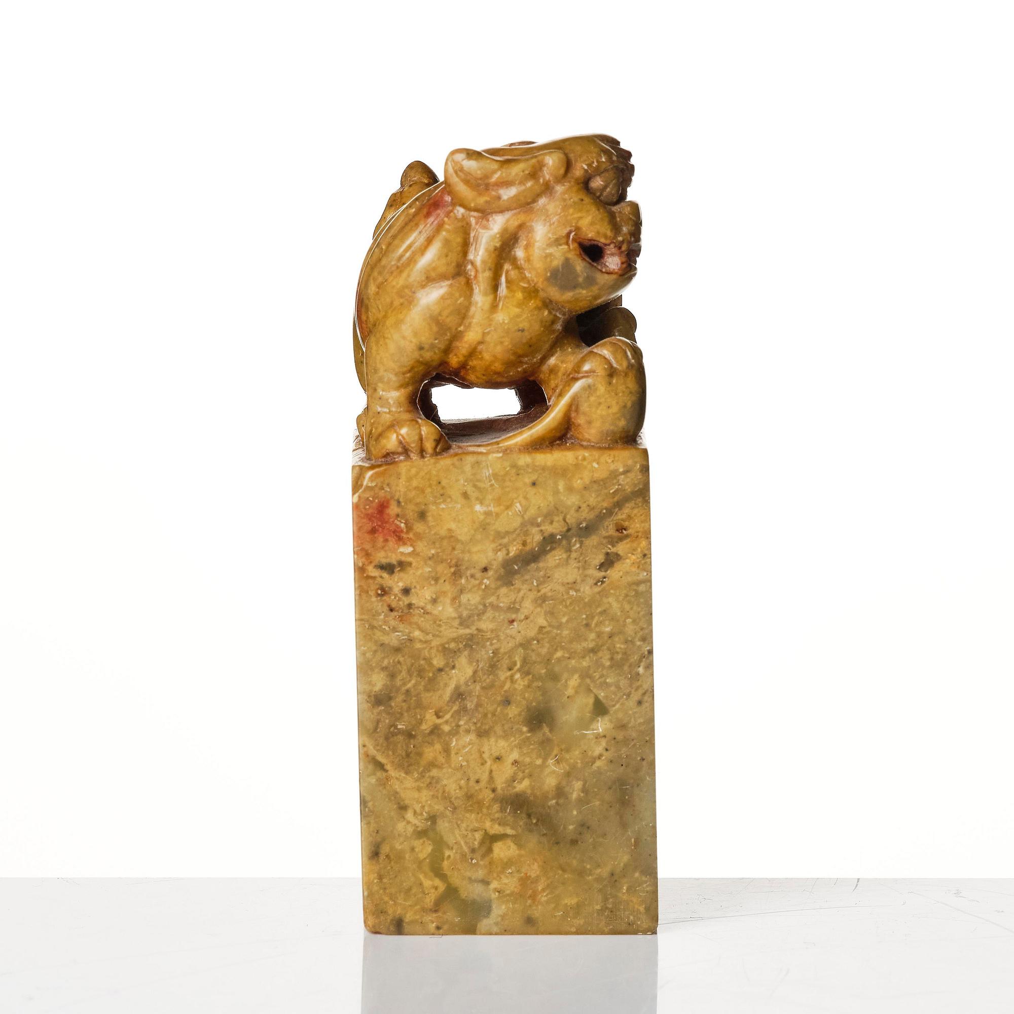 A group of four Chinese stone carvings.