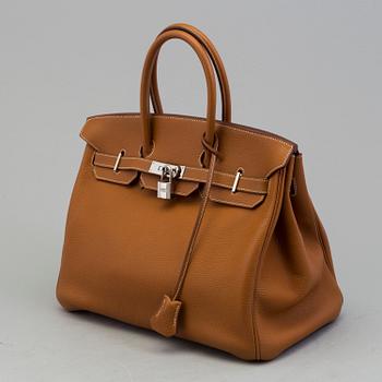 A gold togo Birkin 35 handbag by Hermès from 2004.