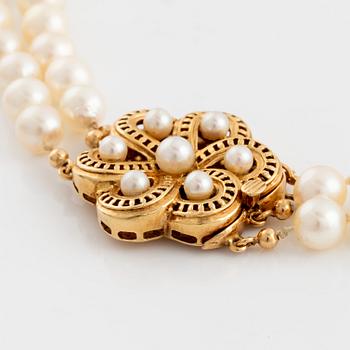 Cultured two strand pearl necklace.