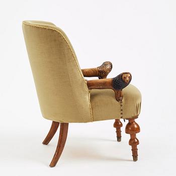 Swedish designer, a stained and carved birch folkart chair, ca 1900.