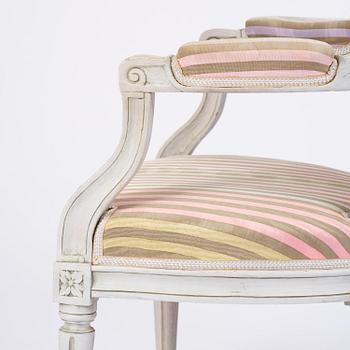 A pair of Gustavian open armchairs by E. Öhrmark (master in Stockholm 1777-1813).