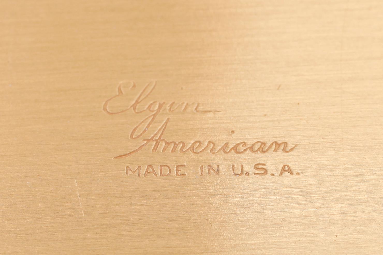 PUDERDOSA, mässing och svart emalj, Elgin, 1900-talets mitt.