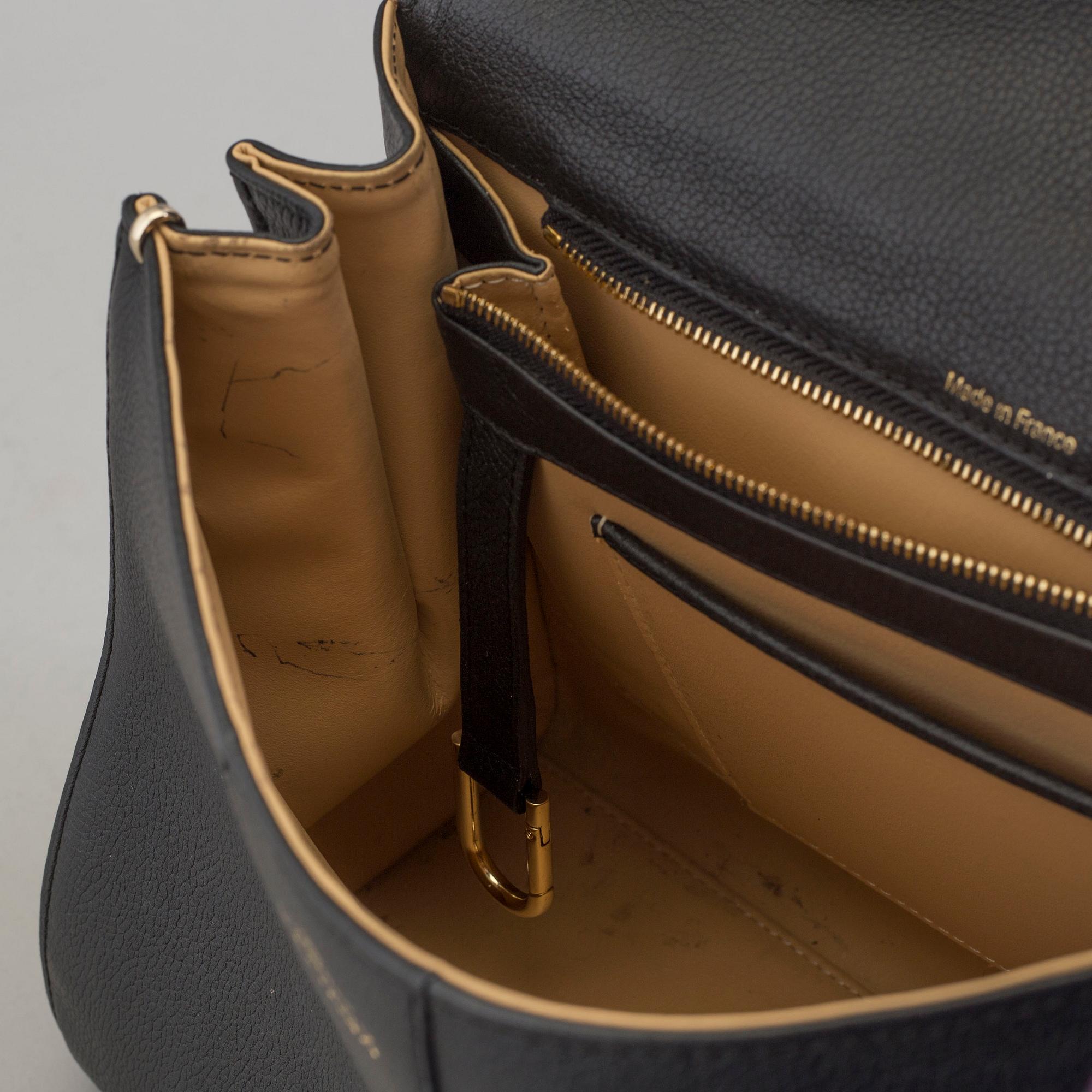 A Delvaux "Brillant" ladies handbag in black colored leather.