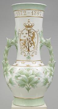 A Karl Lindström porcelain vase, decorated with the portrait of King Oscar II with his motto, Rörstrand 1897.