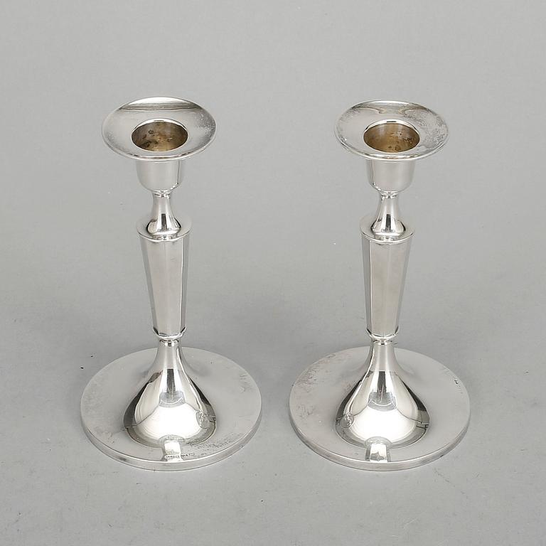 LJUSSTAKAR, ett par, silver, MGAB. Uppsala, 1962.