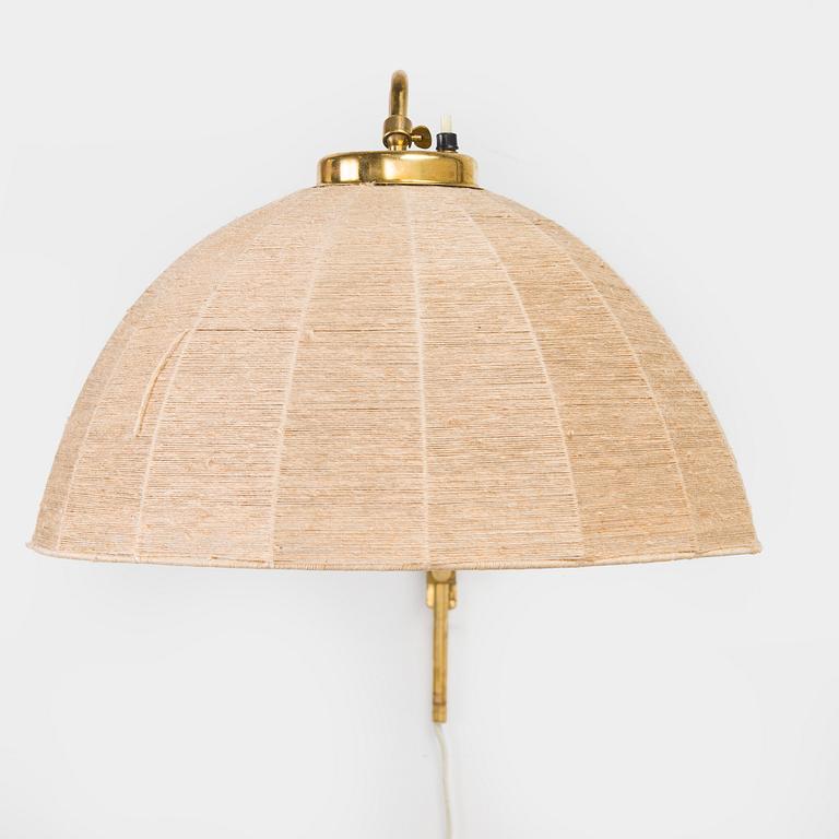 A mid-20th century wall light for Valinte, Finland.
