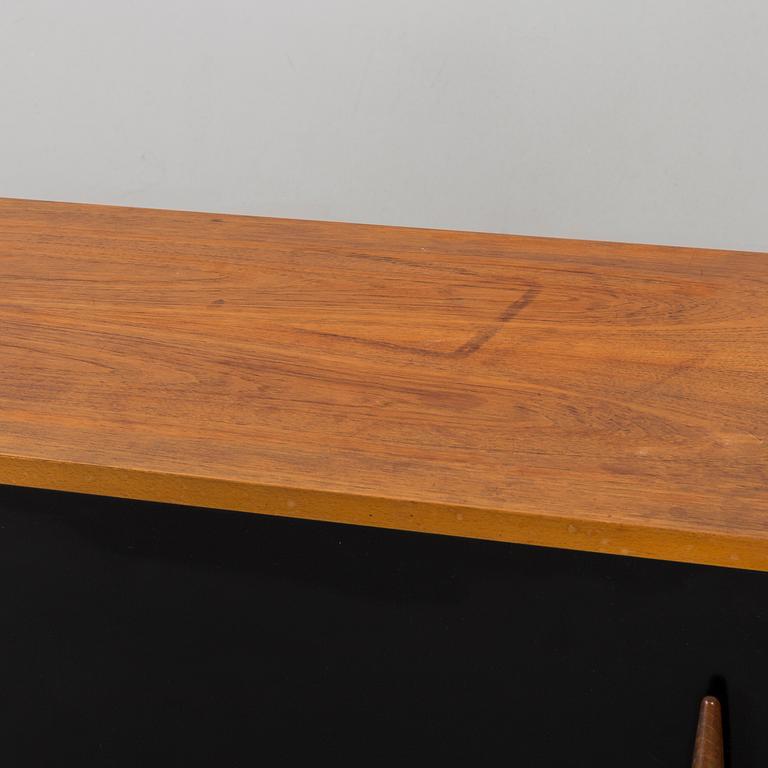 A teak sideboard with black details, by Troeds Sweden, 1960's.