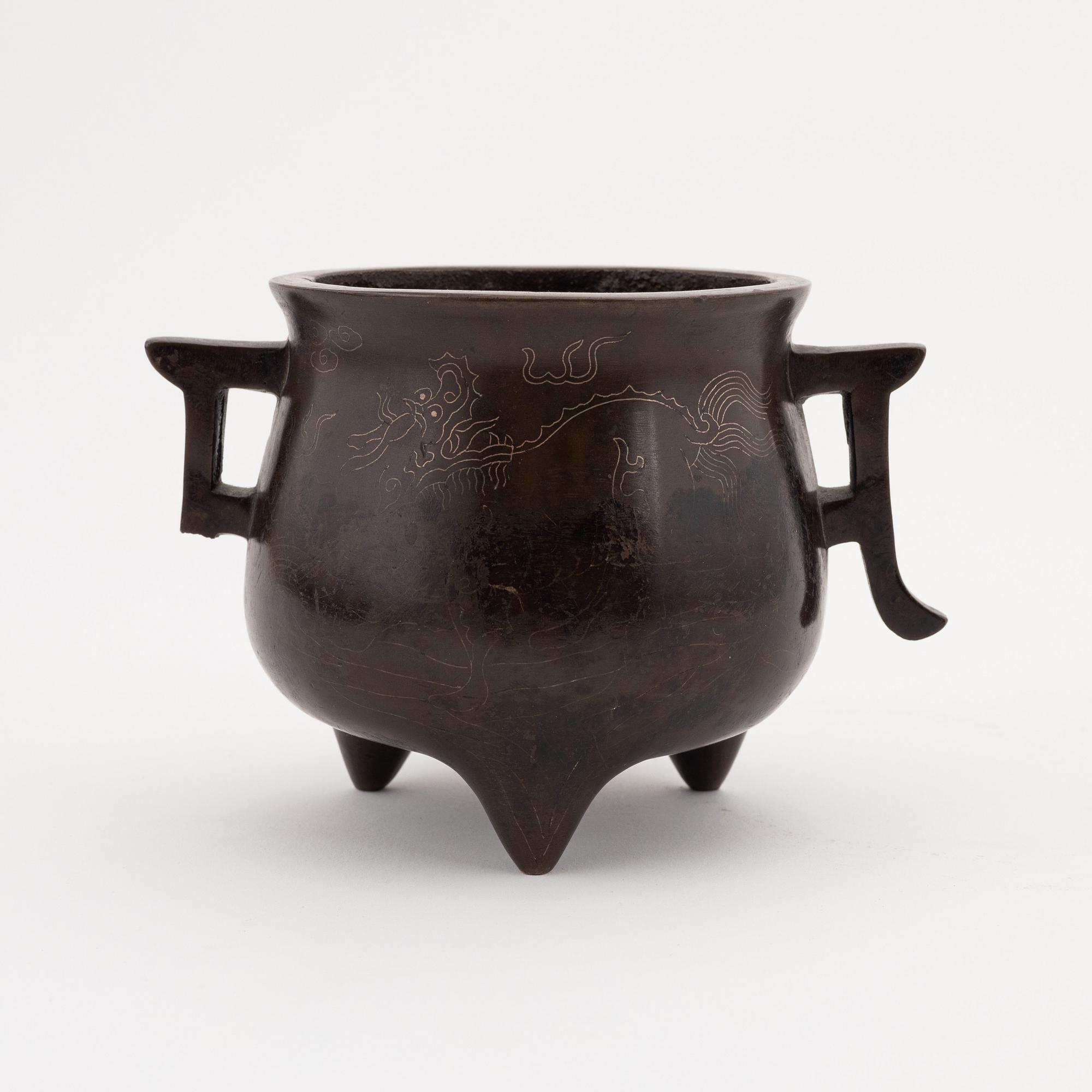 A Chinese tripod bronze censer, 20th century.
