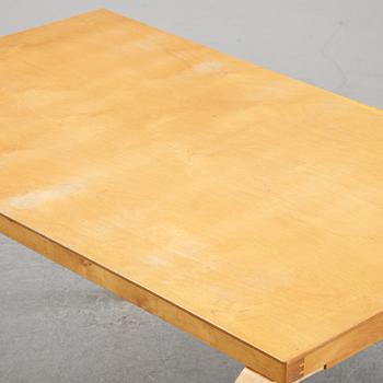 Alvar Aalto, a birch dining table, Artek, Finland, mid 20th Century.