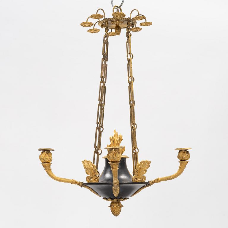 A French Empire ormolu and patinated bronze four-branch chandelier, early 19th century.
