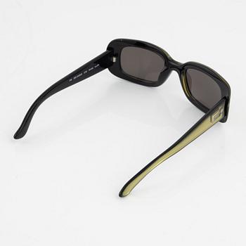 Gucci, a pair of green sunglasses.