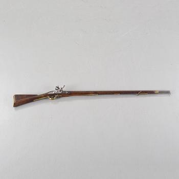 A flintlock rifle from Tower, England, around the year 1800.