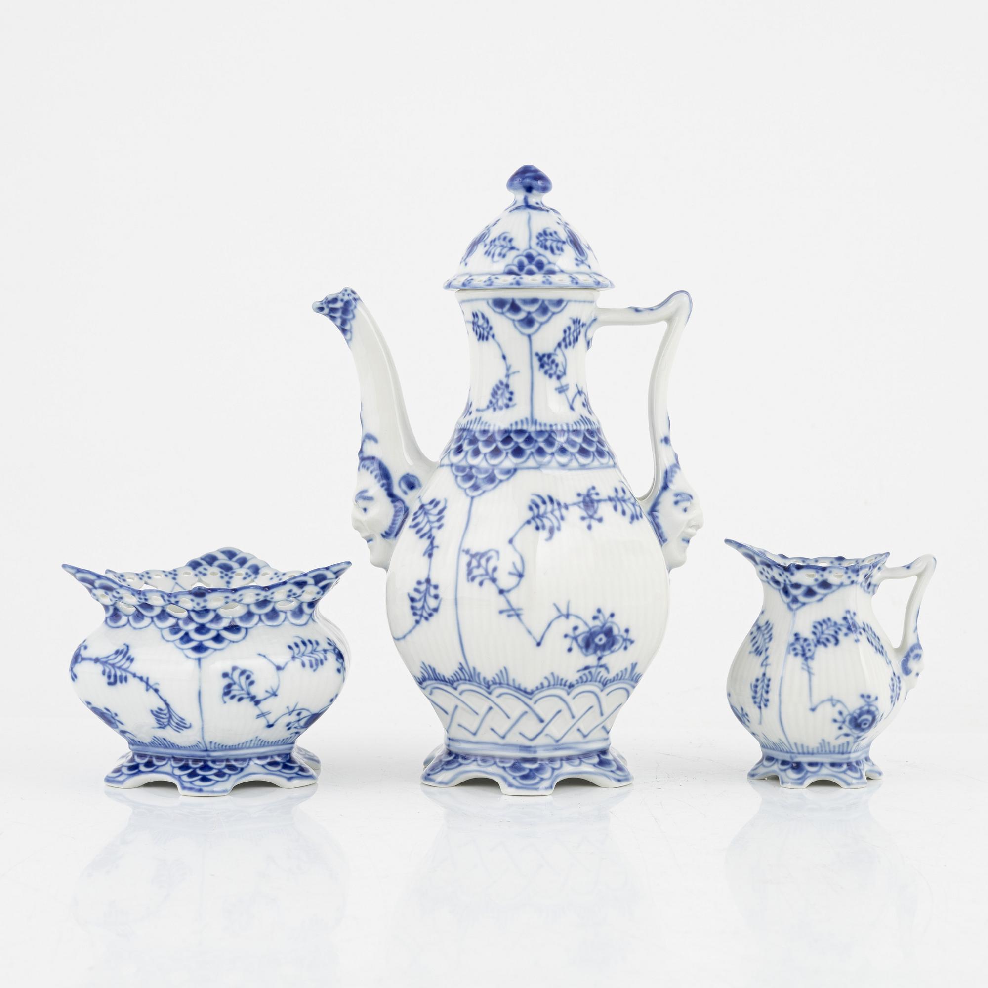 A 'Musselmalet' coffee pot, a sugarbowl and a creamer, Royal Copenhagen, Denmark.