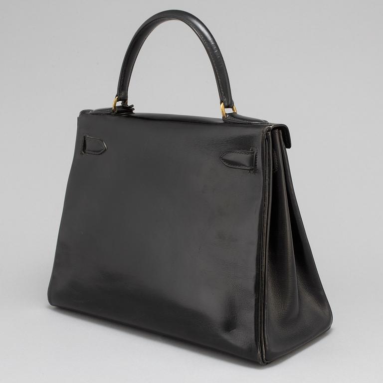 HERMÈS, a black leather 'Kelly' bag, 1970.