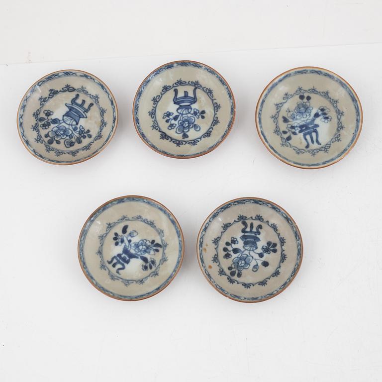 Three Kangxi cups with saucers and five Qianlong cups with saucers, China, 18th century.