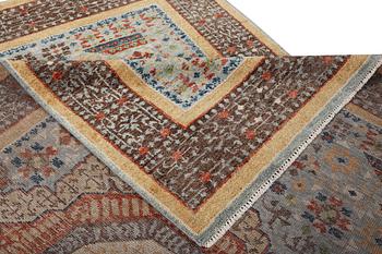 An oriental carpet with Mamluk design, c. 356 x 255 cm.
