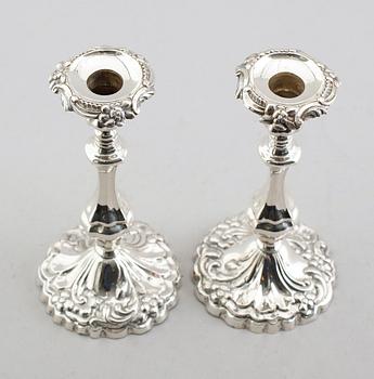 LJUSSTAKAR, ett par, silver, 1861.