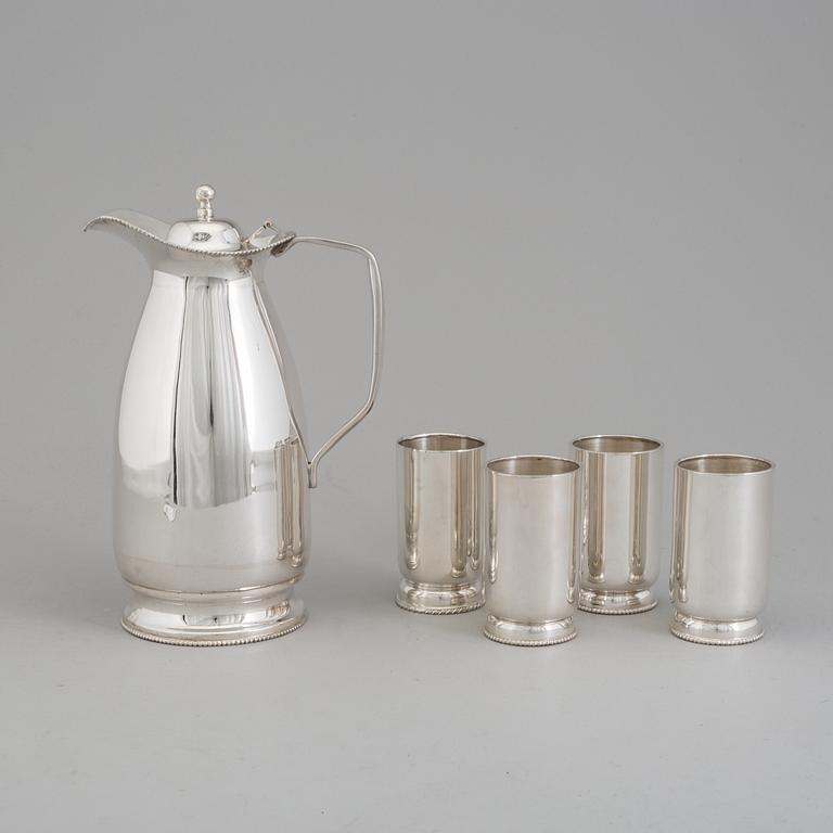 a 5-piece set of a silver jug and four silver glasses.