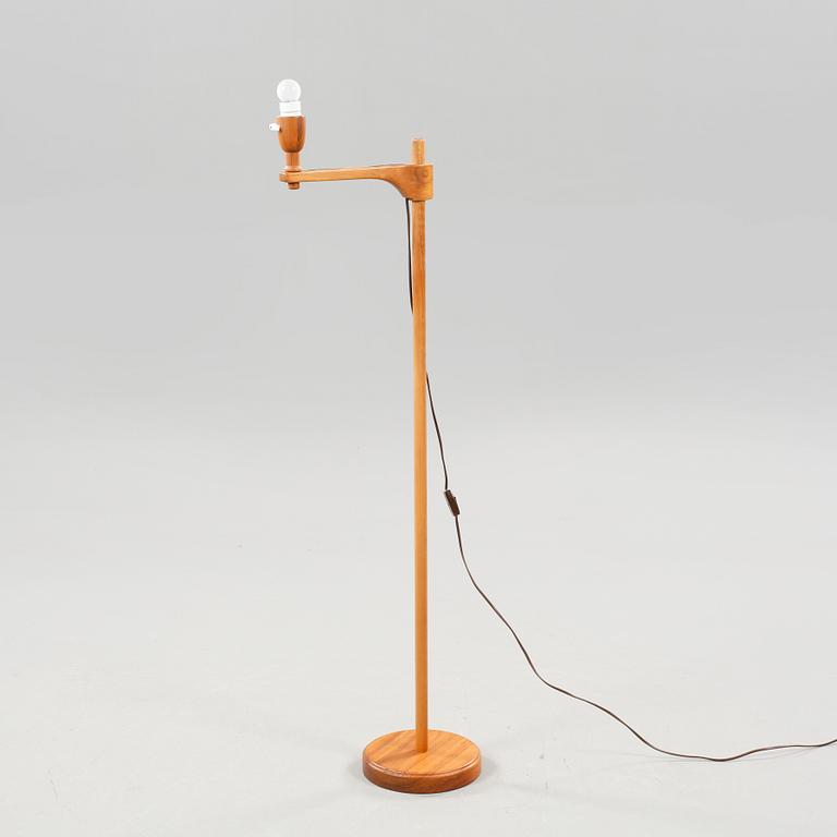 A floor lamp by carl Malmsten called "staken" from the second half of the 20th century.