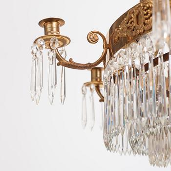 A gilt brass and cut glass nine-light Empire chandelier, first part of the 19th Century.
