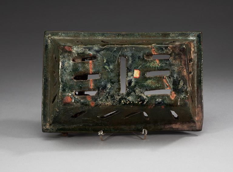 A green glazed vessel, Han dynasty (206 BC – 220 AD).