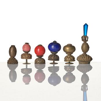 Two boxes with a mandarin's summer hat and black satin autumn hat and feather with six mandarin hat insignias.