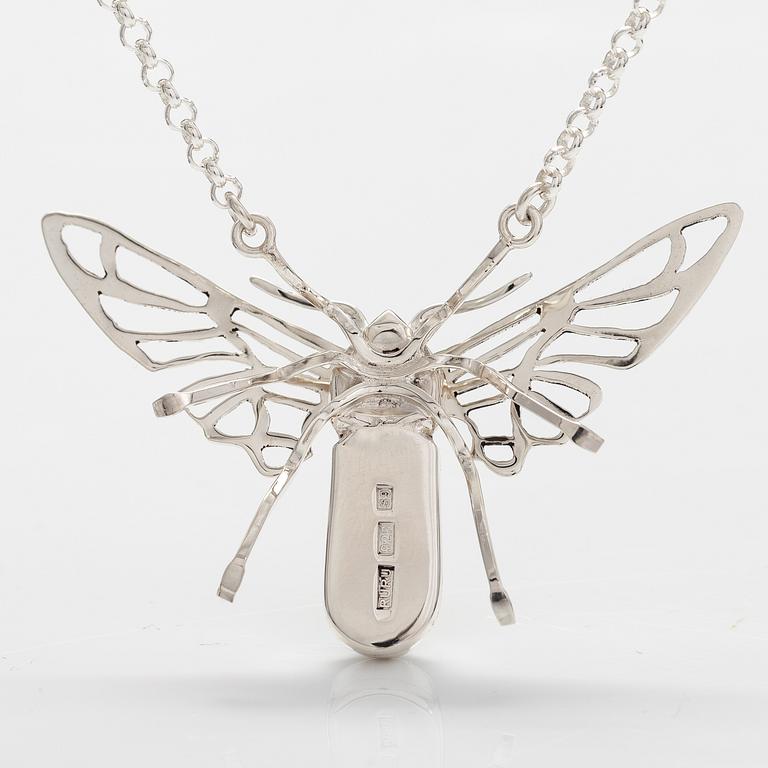 A sterling silver necklace "Moth" with dichroic glass. Ru Runeberg 2019.