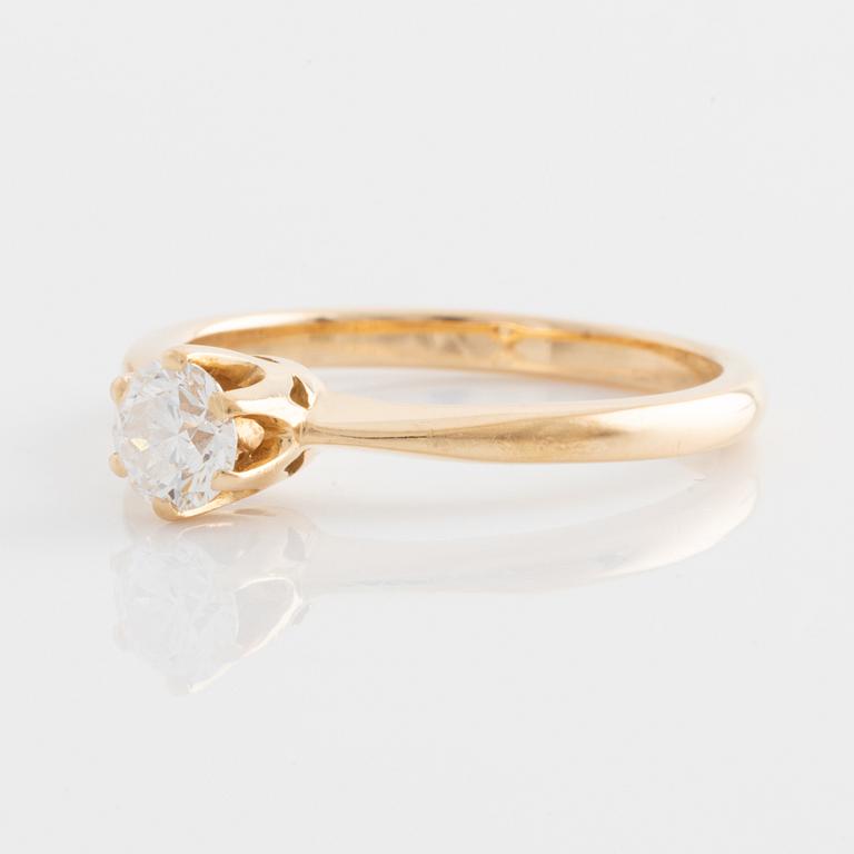 Ring guld 18K med en rund briljantslipad diamant.