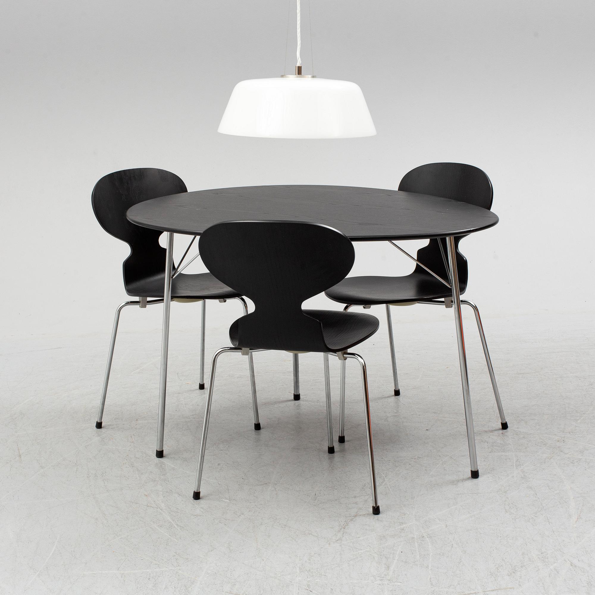 An Arne Jacobsen "Centenary Package" comprising three "Ant Chairs" and an eggshaped table, Fritz Hansen, Denmark.