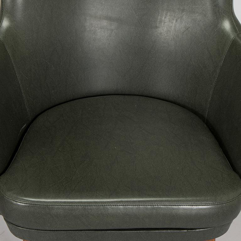 A pair of mid-20th century armchairs.