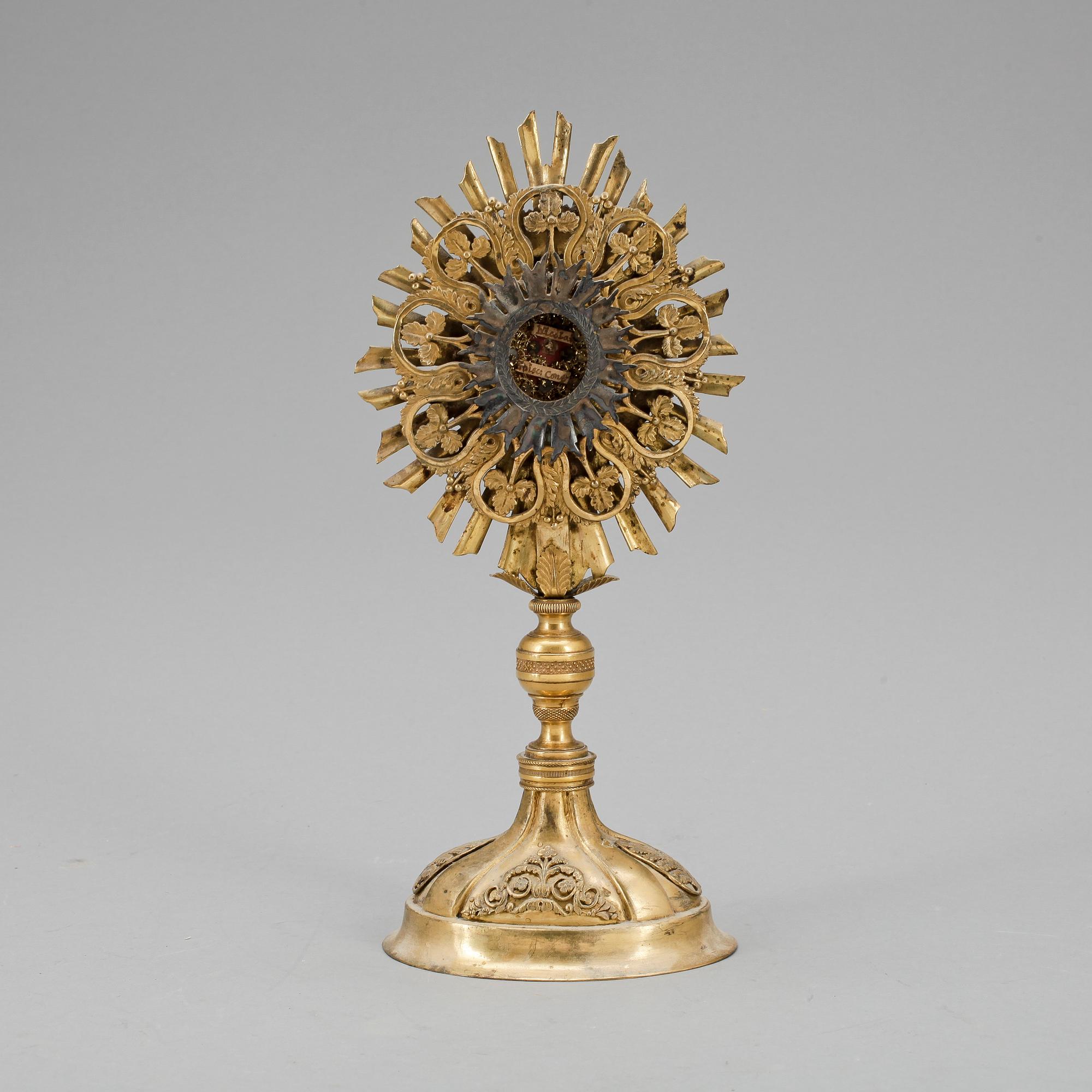 MONSTRANS förgylld mässing, empire, 1800-talets första hälft.