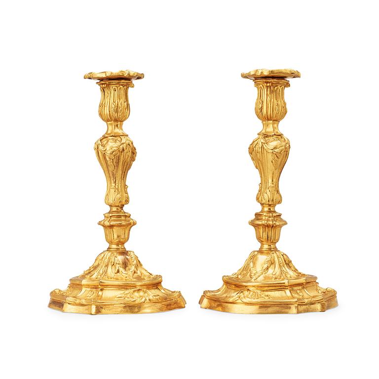 A pair of Louis XV 18th century gilt bronze candlesticks.