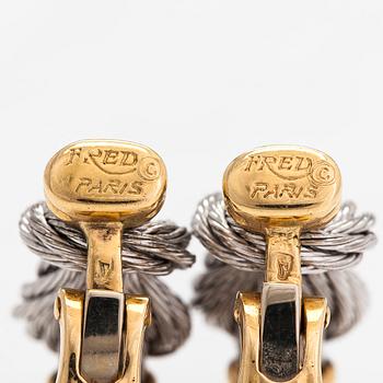 A pair of 'Force 10' earrings, 18K gold and steel. Fred, Paris 1980s.