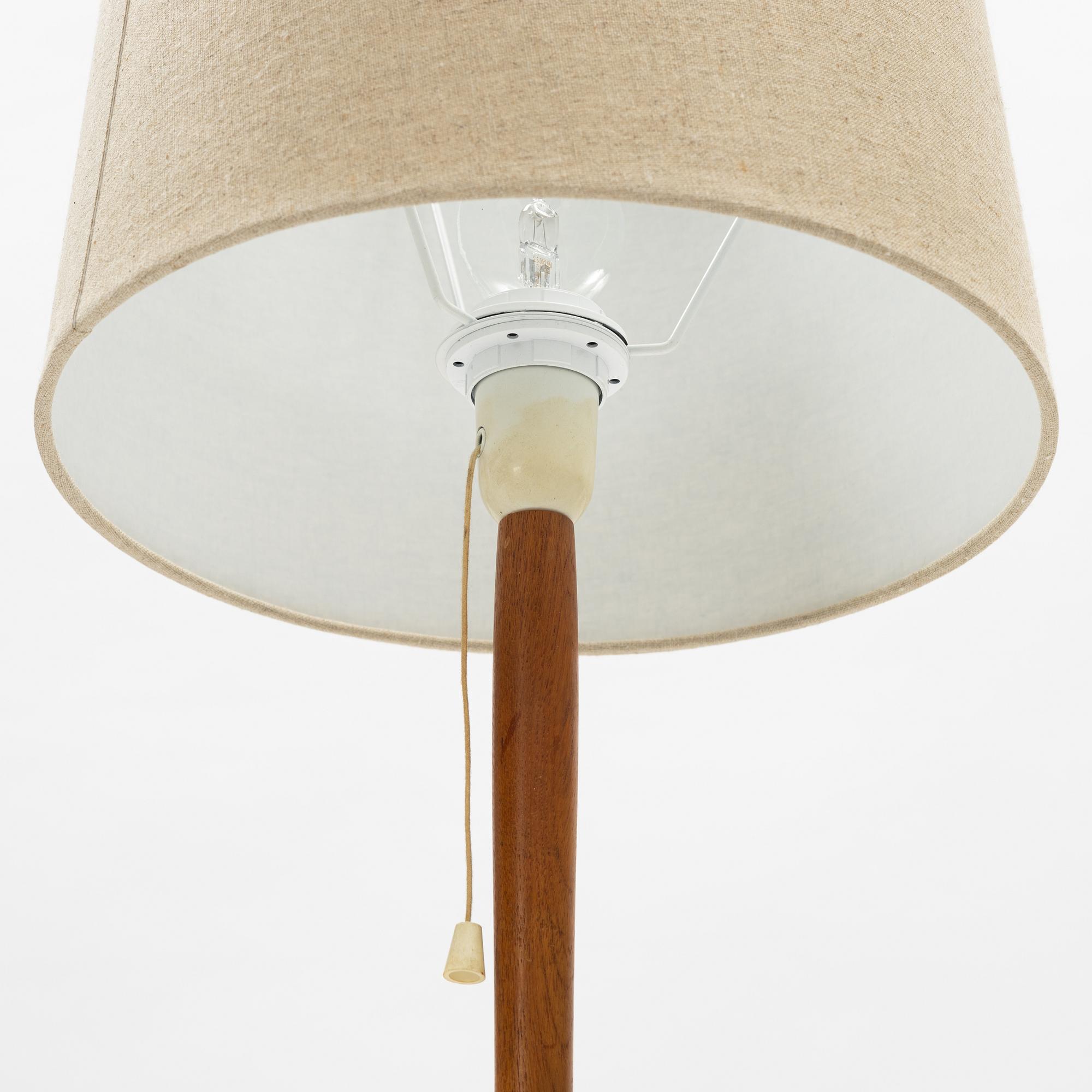 A pair of teak floor lamps, mid 20th century.
