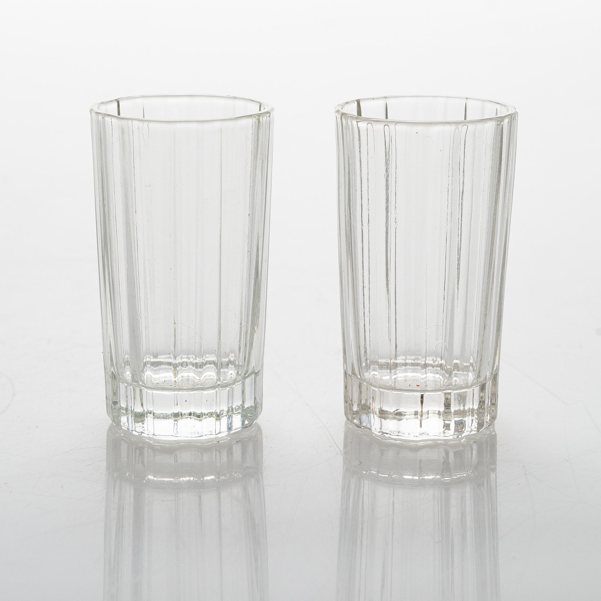 Heikki Orvola, two sets of 70s 'Spektro' schnapps glasses for Arabia, in wood boxes, four and two in each.