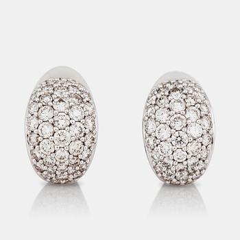 1223. A pair of pavé-set brilliant-cut diamond earrings.