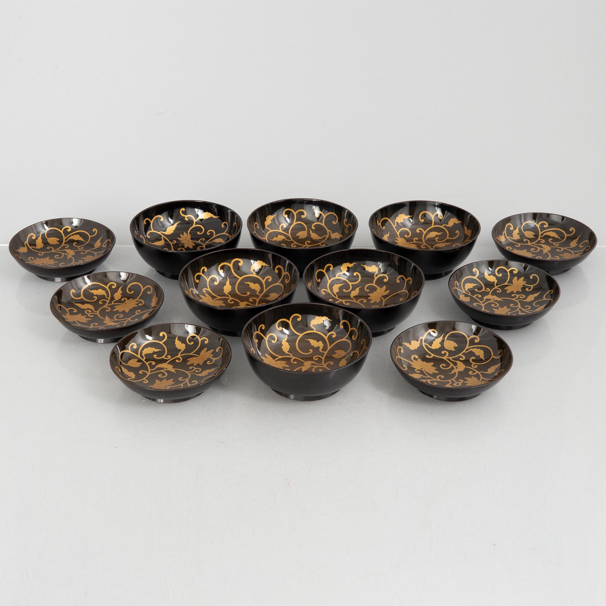 A set of six Japanese lacquer bowls with covers, 20th century.