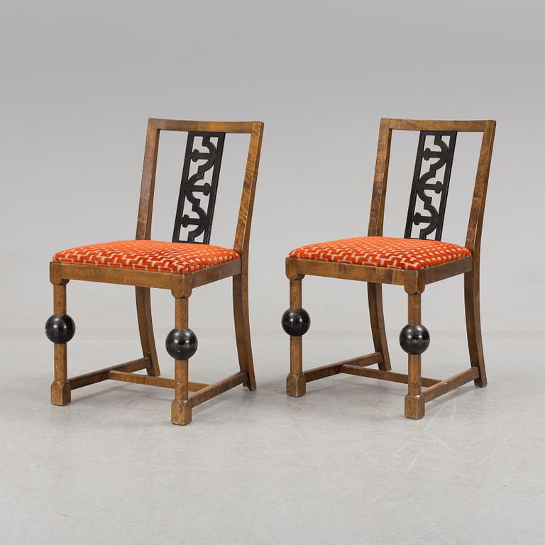 A pair of art déco chairs.