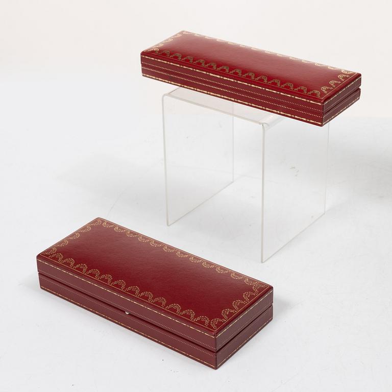 Cartier, Two ballpoint pens, 'must de Cartier' and 'Diabolo de Cartier'.