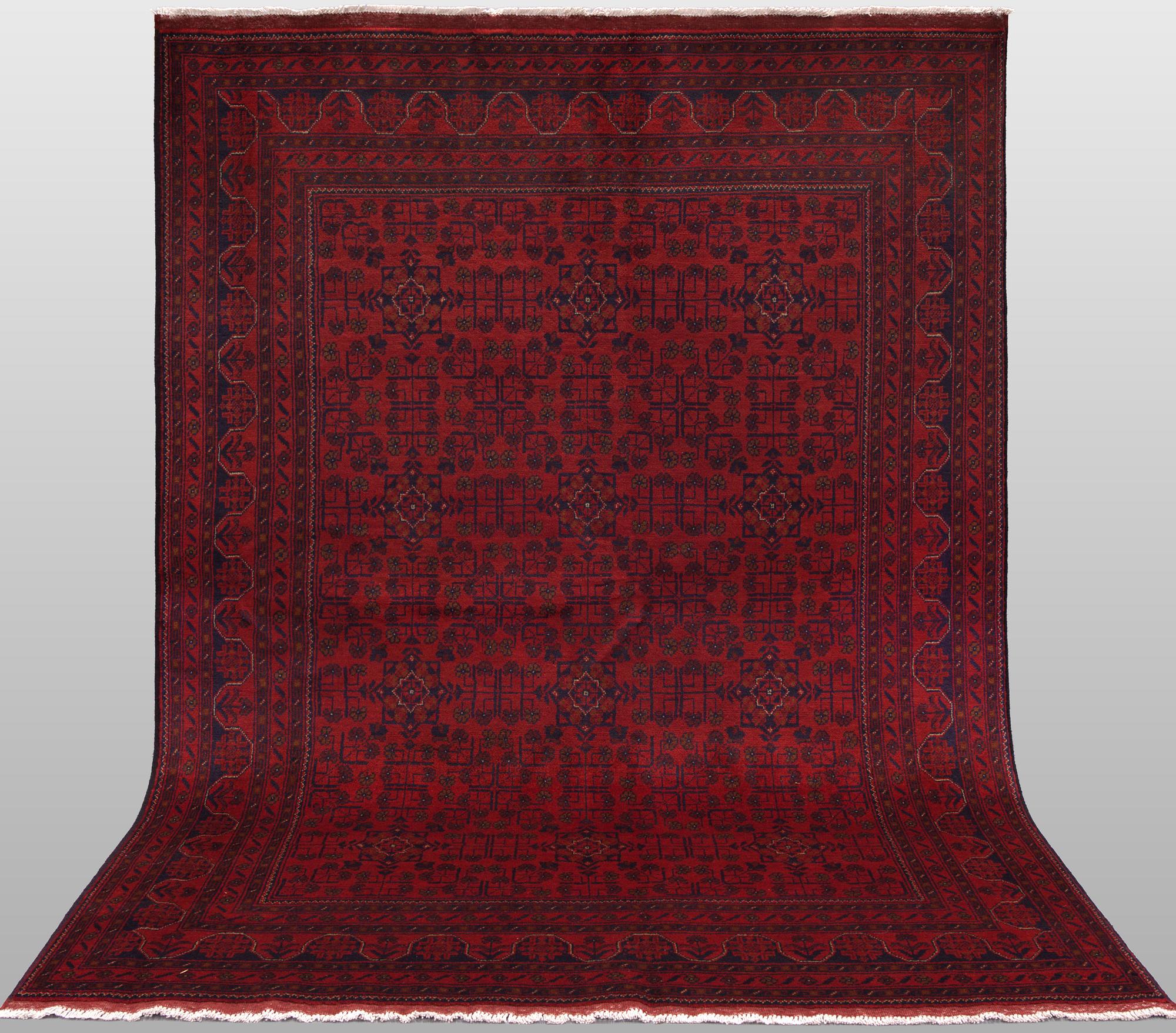 A Afghan carpet, 232 x 167 cm.
