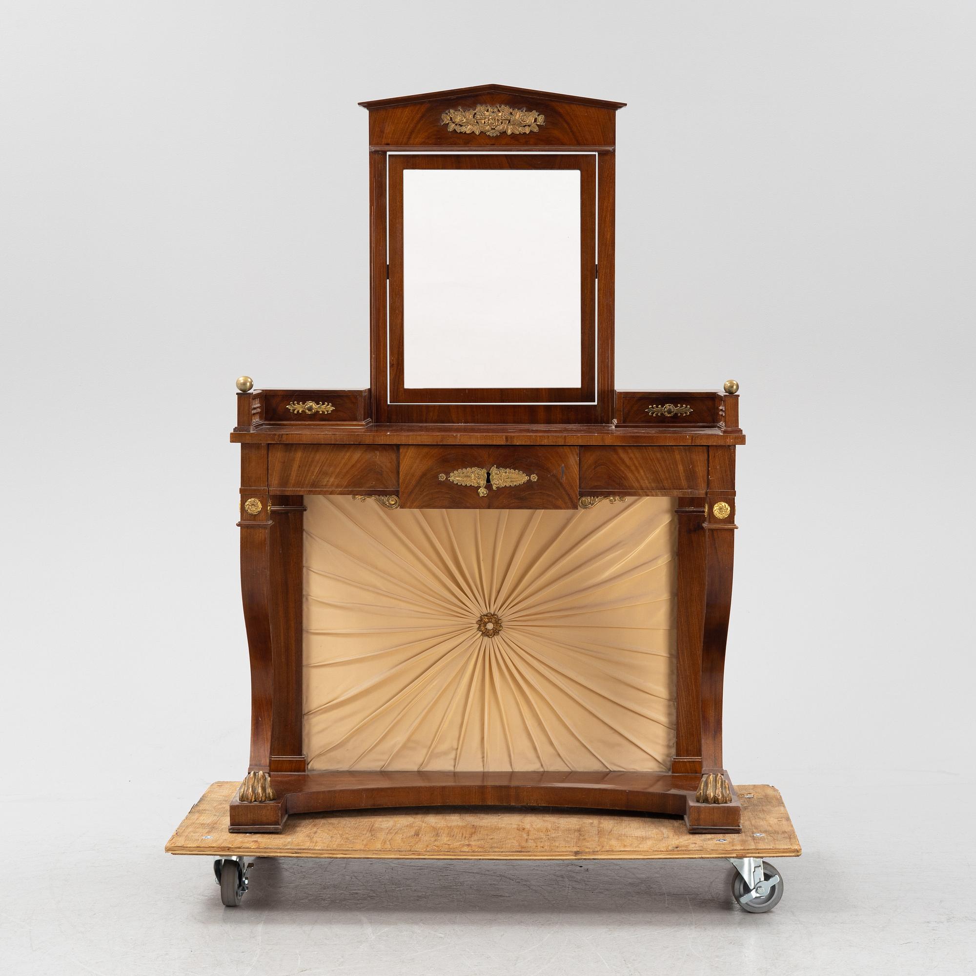An Empire style dressing table by Johan Öman, Stockholm (1815-33), dated 1827.